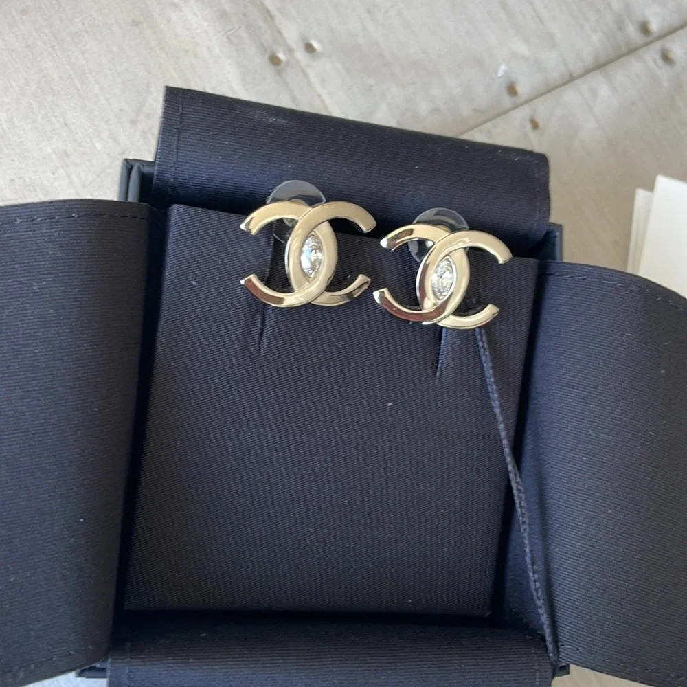 Chanel oversize gold logo earrings with crystal center with box